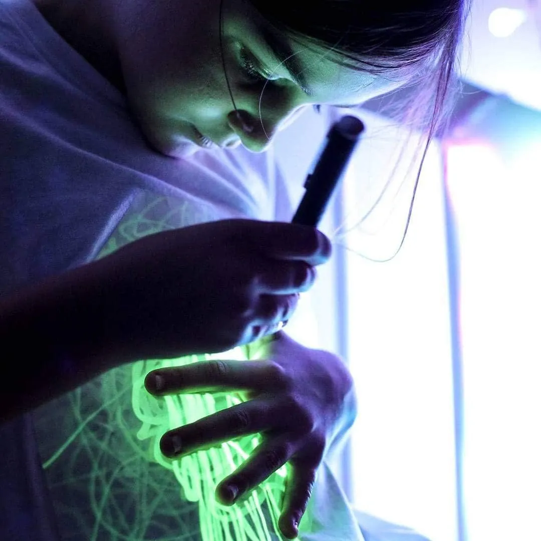 Illuminated Apparel Original Interactive Glow in The Dark T-Shirt - Fun for Birthday Parties & Festivals